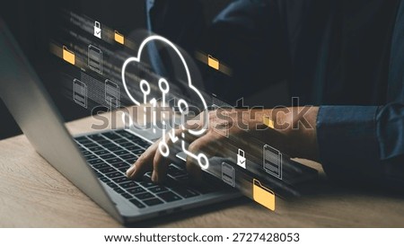 Cloud data interface with folder and document icons shows secure digital storage, real-time file transfer, and database management, operated through laptop for efficient business communication.