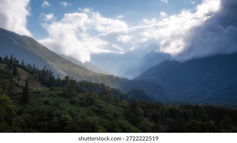 [Cloud Gap Mountain Light, Emerald Ridge Gilding] In the mountain stream torn open by clouds and mist, the gilding light envelops the tiered emerald ridges, as if blending the spiritual elegance of the wilderness into the shadows, suitable for cultural tourism promotion, natural aesthetics, and outdoor healing commercial visual scenes