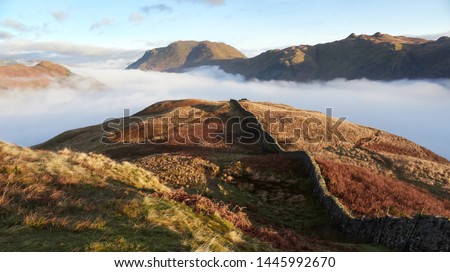 Cloud inversion over Patterdale with Arnison Crag to the left, Place Fell and on the right from Hartsop Above How in the Lake District.