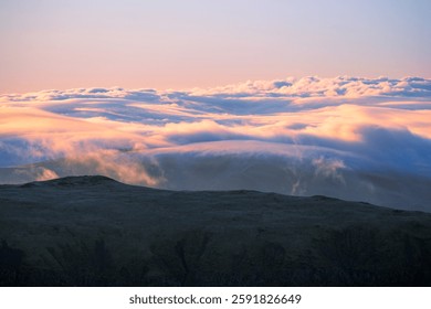cloud inversion seen from Helvellyn summit in The Lake District mountains, UK.