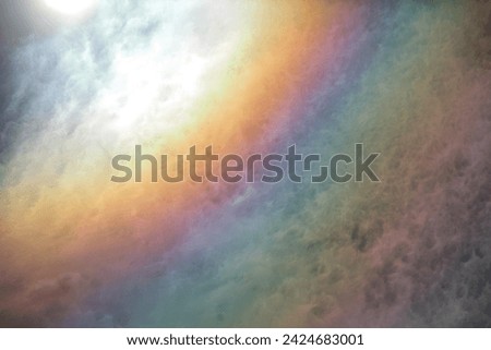Cloud iridescence formed by the diffraction of sunlight on water droplets that form the clouds. The diffraction is a very complex phenomenum, unlike reflection and refraction.