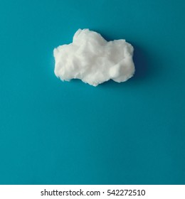 Cloud Made Out Of Cotton Wool On Blue Background. Flat Lay. Weather Concept.