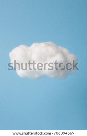 cloud made out of cotton wool  on sky blue background