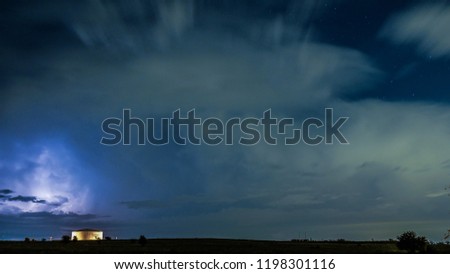 Cloud movement in a starry night with a lightning storm in Fort Worth Texas