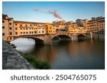 A cloud over the Ponte Vecchio bridge early in the morning in Florence.