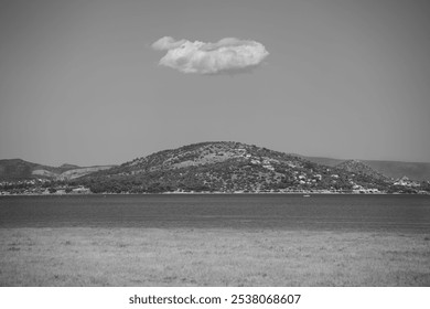 Cloud over a small  mountain 