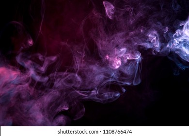 Cloud Of  Pink And Purple Smoke On A Black Isolated Background. Background From The Smoke Of Vape
