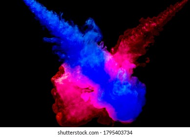 A cloud of red and blue paint released into clear water. Isolate on a black background. - Powered by Shutterstock