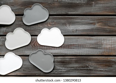 cloud service concept with clouds on wooden background top view mockup