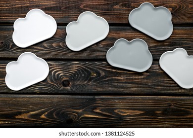 cloud service concept with clouds on wooden background top view copy space