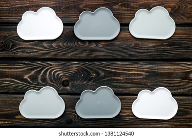 cloud service concept with clouds on wooden background top view mockup