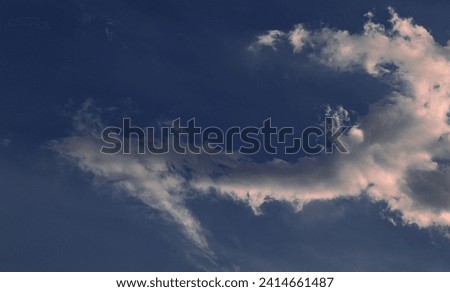 Cloud shaped like a bent arrow in the sky