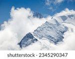 cloud and snow covered peaks of Grand Cornier and Dent Blanche in the background, Valais