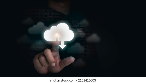 Cloud storage concept. Cloud computing technology, virtual icons touched by a businessman with binary code on dark background with copy space. Business transformation, big data on the internet.