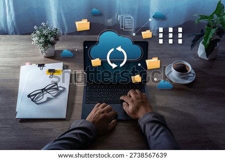 Cloud Storage Data Synchronization File Management on Laptop cloud storage and data synchronization icons representing business technology and remote work.