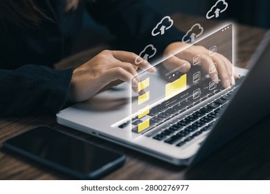 Cloud storage and digital file management concept with businesswoman using laptop, organizing folders, uploading documents, secure data backup, online collaboration, and modern cloud computing.