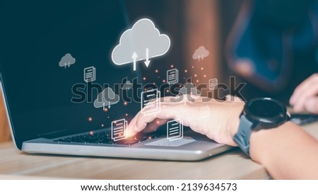 Cloud storage technology concept. Businessmen use laptops to synchronize documents or data to online storage. Upload and download files. Data sharing and transfer network.  