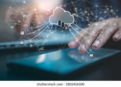 Cloud storage technology, internet network connection, business and technology concept. Person working on laptop and mobile phone with cloud computing diagram on virtual screen