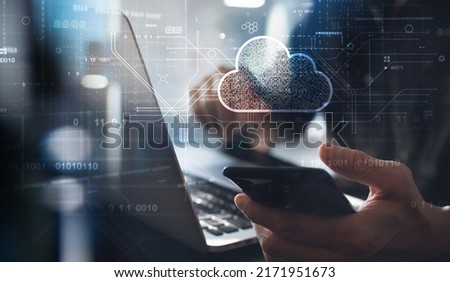 Cloud technology. Data storage and backup. Networking and internet service concept. Man using laptop computer and mobile phone with cloud computing diagram. Foto stock © 