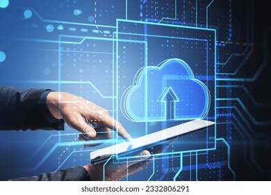 Cloud technology and data transfer concept with male hand working with digital tablet and cloud symbol hologram, double exposure
