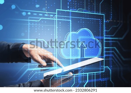 Cloud technology and data transfer concept with male hand working with digital tablet and cloud symbol hologram, double exposure