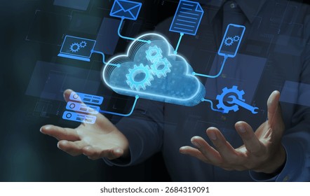 Cloud virtualization and virtual machine. Business person holding cloud and gear icons.