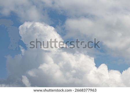 A cloudless sky with a few clouds. The sky is blue and clear. The clouds are white and fluffy