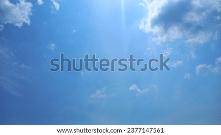 The cloudless sky is a picturesque backdrop that enhances the island's charm.