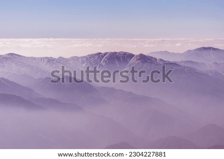 Similar – Landscape with sunset in blue mountains