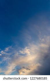 Clouds after rain before sunset as a background .