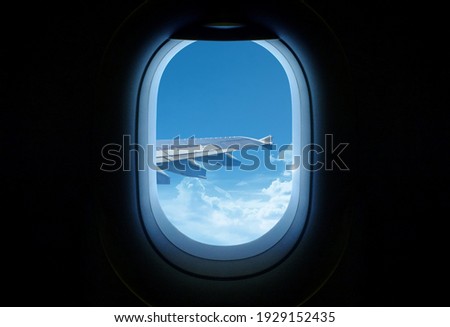 Clouds in the aircraft's porthole.