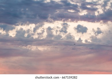 Clouds (and one tiny jet)
