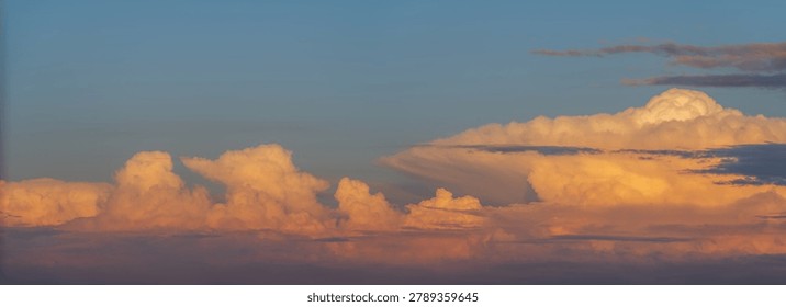 Clouds appear in sky as sun sets. Hues change and create colorful spectacle. Bas Rhin, Alsace, France, Europe.
