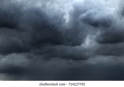 clouds background.Clouds become dark gray like a big smoke before rainfall.Thunderstorm is a storm with lightning and thunder. Air pilots know that they must never fly through a thunder cloud
