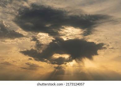 Clouds block the sun at sunset in the form of a human face