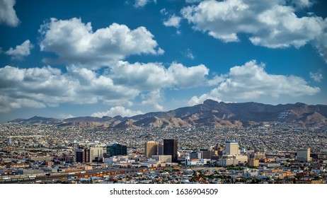 Clouds And Blue Skies Over El Paso, Texas And Juarez, Mexico.  The Inscription On The Mountain Reads 