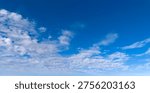 Clouds blue sky background texture. Bright soft clouds white pattern. Daytime clouds wallpaper backdrop. Clouds cumulus skyscape.