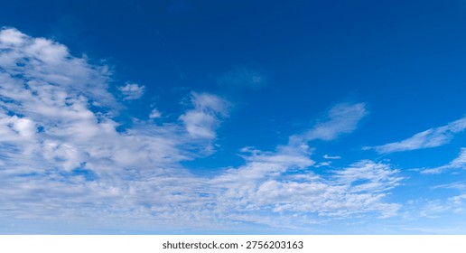 Clouds blue sky background texture. Bright soft clouds white pattern. Daytime clouds wallpaper backdrop. Clouds cumulus skyscape.
