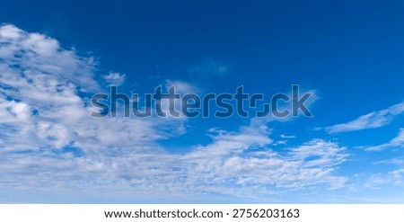 Clouds blue sky background texture. Bright soft clouds white pattern. Daytime clouds wallpaper backdrop. Clouds cumulus skyscape.