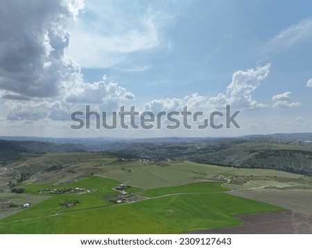 clouds, blue sky and green ground