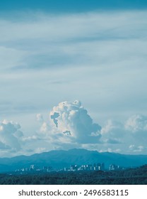 Clouds and blue sky hover over the city. landscape, background