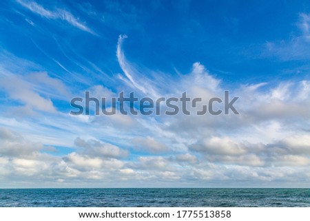 Similar – wooden platform with blue posts with ropes and orange lifebuoys on the background of the sea and sky with clouds Egypt Dahab South Sinai