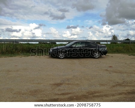 Clouds with car background in Lithuania