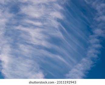 Clouds - cirrus cloud - in the shape of a waterfall in the blue sky - Shutterstock ID 2311192943