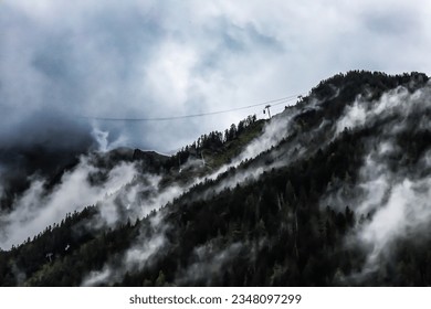 the clouds clinging to the mountain