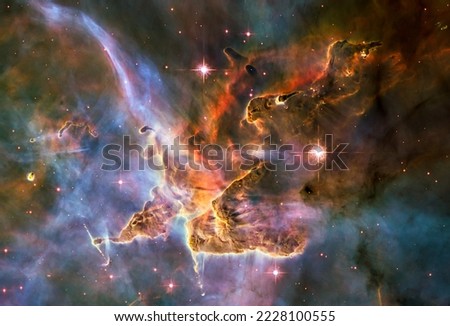 Clouds of cold interstellar gas and dust located in the Carina Nebula, in the southern constellation Carina. Pillar of dust and gas. Elements of this image are furnished by NASA.