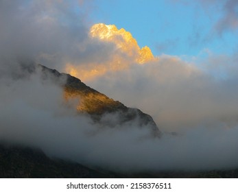 The Clouds Covering The Mountains In Chamonix, France