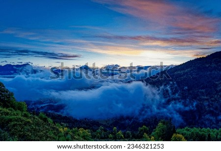 The clouds descended at dawn. Mountain hill in clouds. Cloudy mountain hills at dawn. Mountain sky clouds in morning