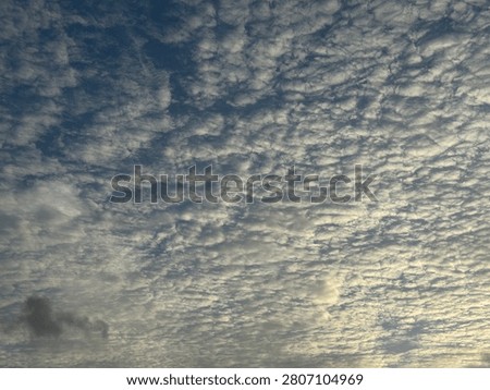 Clouds design makes the sky very beautiful. God’s creation. Very beautiful view on a rainy evening. Blue sky and fluffy abstract white clouds. 