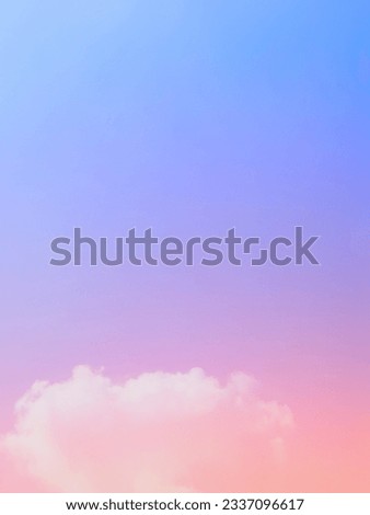 Clouds, faded mist, soft white  On the nature sky background at twilight.  Subtle gradients of orange, blue, purple, and pink create a beautiful golden pastel